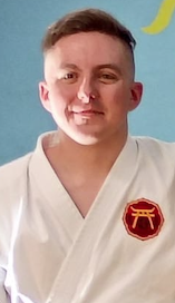 Damase Collins Sensei in a white karate gi