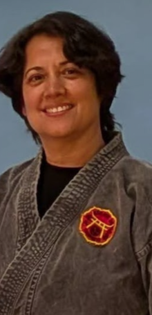 Michele Elefante Sensei in a white karate gi